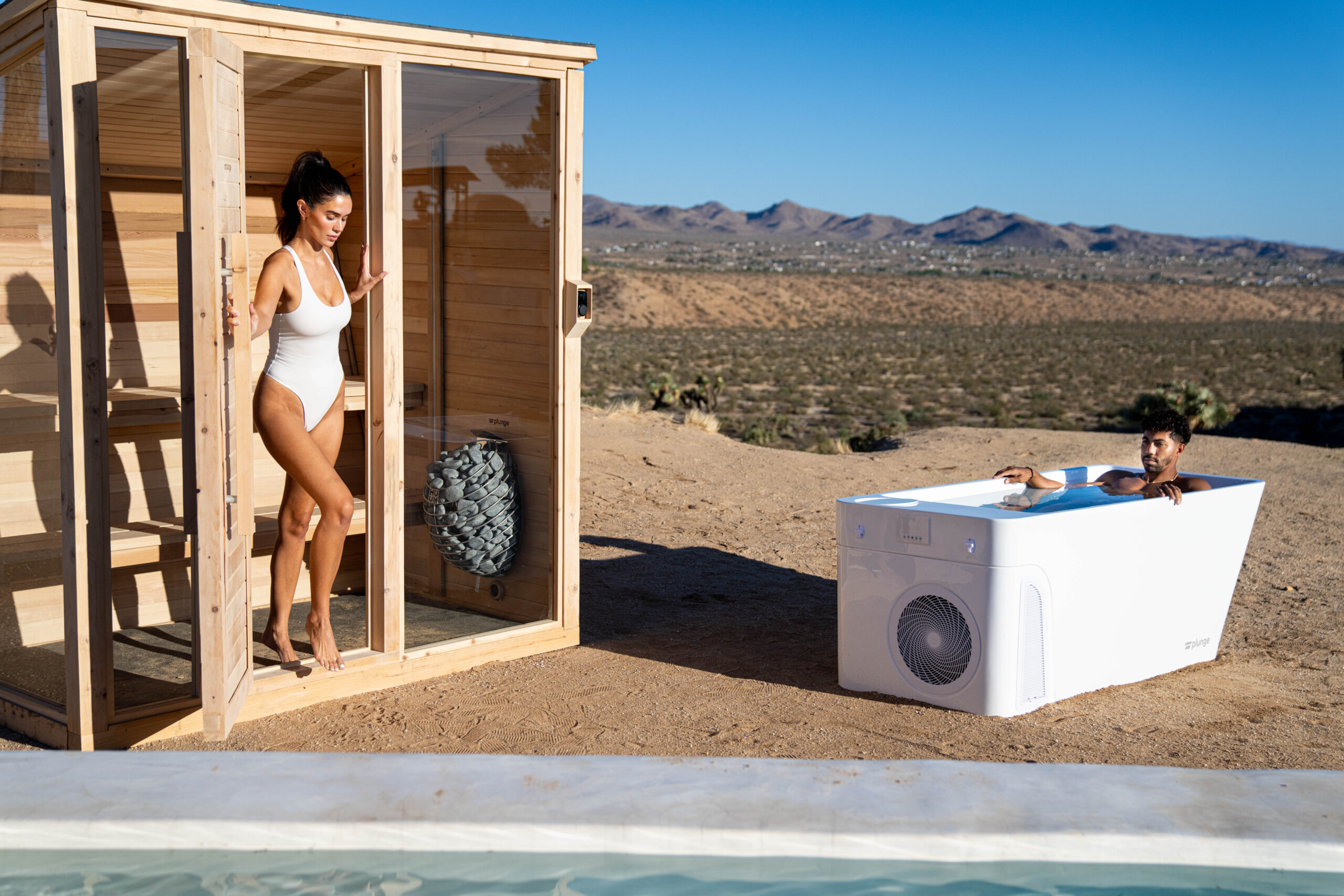woman in a sauna and man in a cold plunge in the desert