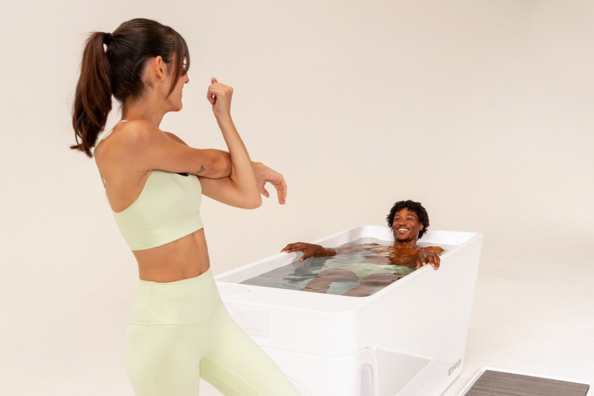 Woman staring at a man in a plunge tub